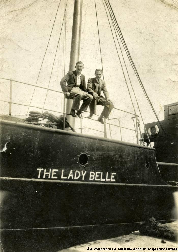 Two Men Sitting On The Bow Of The Lady Belle