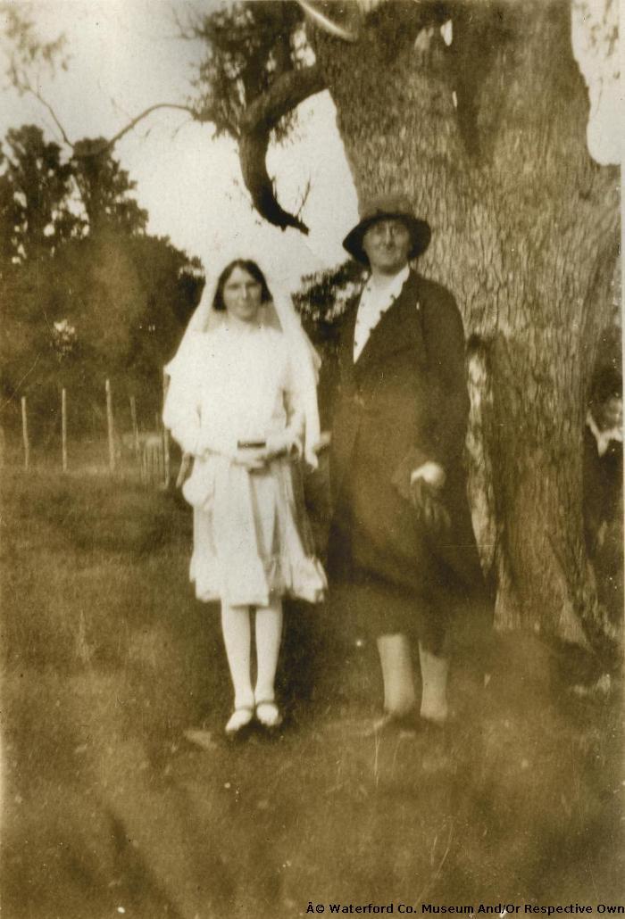 Lady With Girl In Confirmation Dress And Veil.