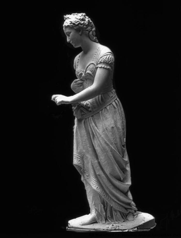 Statue Of Lady On A Plinth