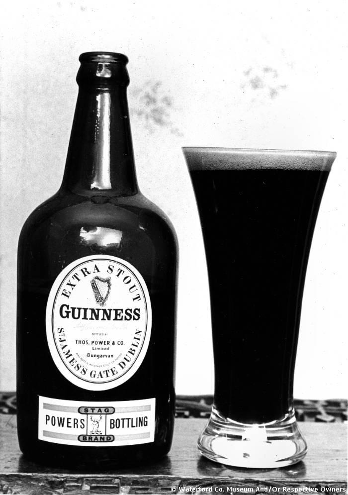 Bottle And Glass Of Power's Bottled Extra Stout Guinness