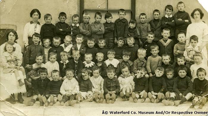 A Large Group Of Children Posing For A Photograph