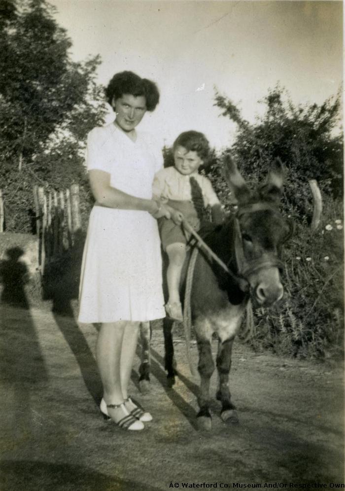 Lady With Child On Donkey