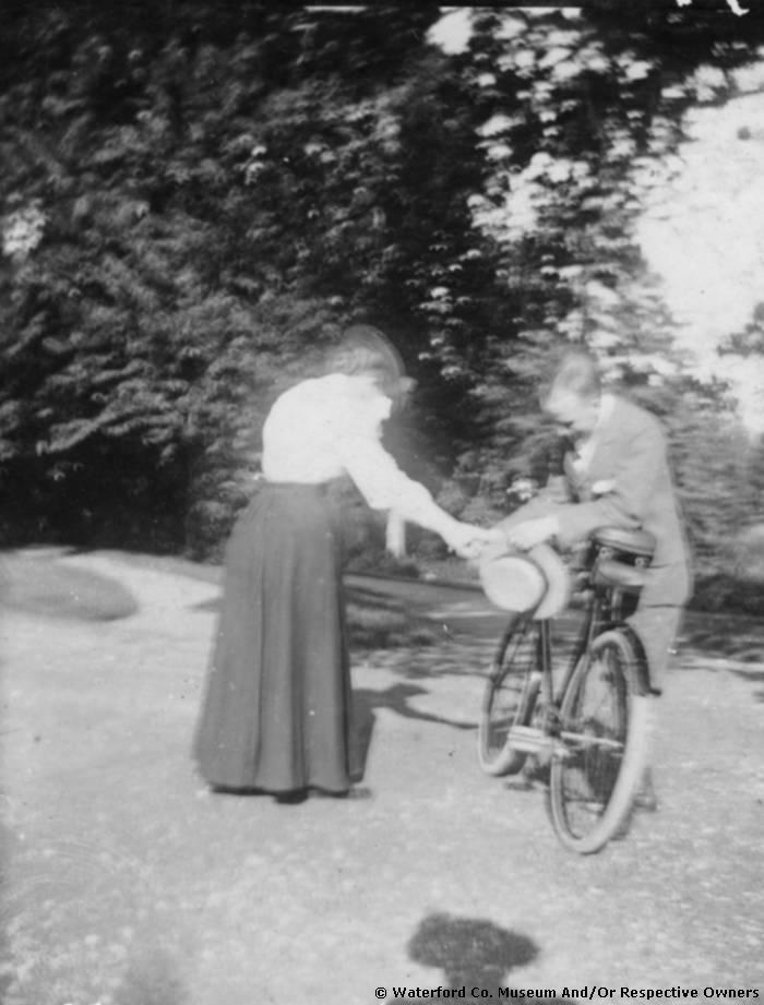 A Man & Woman With A Bicycle At Comeragh House