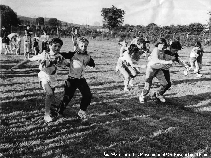  Group Of Children Running The Three Legged Race