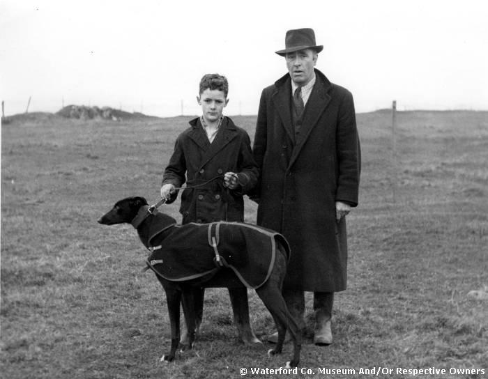 Unidentified Man And Boy With Greyhound