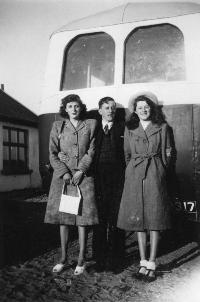 Two Ladies Standing With Jackie Kenneally Behind One Of His Buses