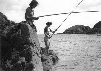 Ladies Fishing Off Rocks At Helvick, Ring