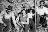 Four People Sitting In Hay Field, Monatrea