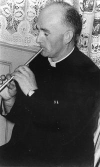 Father Riordan Playing A Tin Whistle
